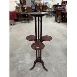 A mahogany 'muffin' plant stand on tripod support. 42½' high