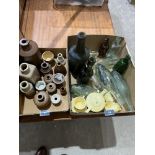 A collection of old bottles, stoneware jars and a tea set