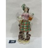 A 19th century Staffordshire figure of a Scotch lady. 8¾' high