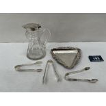 A silver pin dish, Birmingham 1964; three silver sugar bows and a cut glass truncated oil bottle