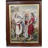 A 19th century Berlin woolwork. Three figures in a landscape