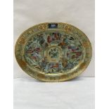 A 19th century Chinese oval dish, painted in coloured enamels and gilded with figure scenes and