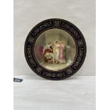 A Vienna cabinet plate painted with a classical figure scene signed. P.Herr. 9½' diam.