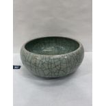 A Chinese pottery cracalure celadon glazed bowl. 10½' diam.