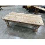 A joined pine low table on turned legs. 48' long