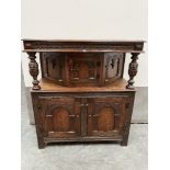 A 17th century style oak carved press cupboard. 44'w x 48'h