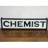 A glass Chemist shop sign. 13' x 54' (Cracked)