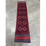 A Meshwani carpet runner. 2.43m x 0.56m