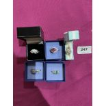 Five silver gem set rings