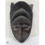 An African ebony wood carved mask. 14½' high