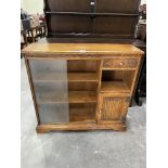 A oak glazed bookcase. 36' wide