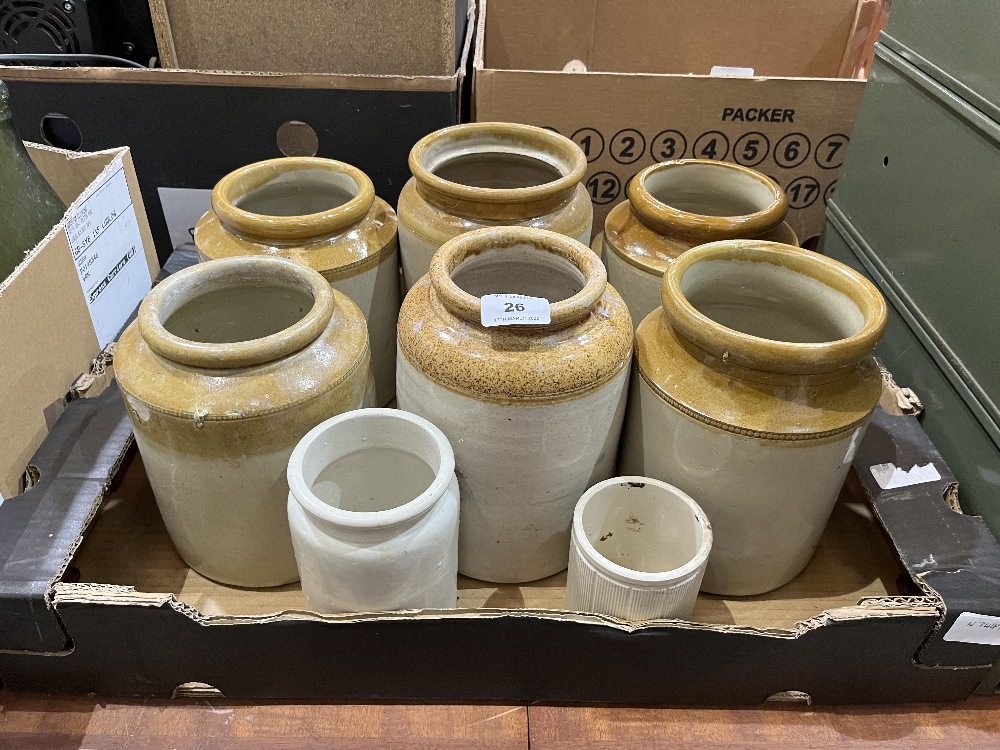 A box of stoneware jars