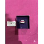 A pink and white stone ring. In gold marked 375. 2g gross. Size K