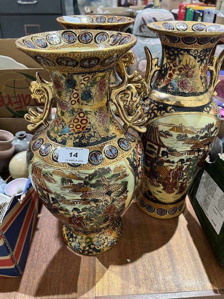 A garniture of three 20th century Chinese inverted baluster vases. 14' high