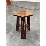 An Arts and Crafts oak hexagonal occasional table. 14½' diam.