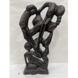An African carved ebony sculpture of sinuously entwined body forms. 22½' high