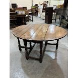 An 18th century joined oak gateleg table on baluster turned legs. 43'w x 25½'h. Formerly with a