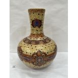 A 20th century Chinese globular vase painted and gilded with flower heads and jewelled diaper