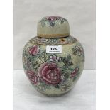 A Chinese famille-rose decorated jar with cover, painted with foliage on a crackle ground. Of recent