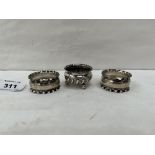 A silver salt and a pair of silver napkin rings. 1oz
