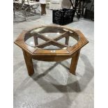 A 1970s octagonal low table with inset glass top. 29½' diam.