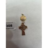 A 9ct Celtic cross and a medallion marked 585. 8g
