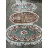 Three Chinese oval rugs