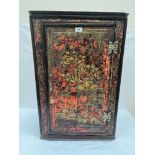 An 18th century chinoiserie decorated corner cupboard, the door with pierced brass butterfly hinges.
