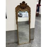 A George I style pier glass, the foliate moulded frame with shell surmount and shaped plate. 62½'