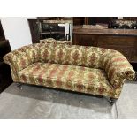 A Victorian chesterfield sofa on turned legs. 78' wide