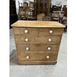 A Victorian pine chest of two short over three long drawers. 40' wide