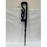 An African serpent carved ebony stick. 36' long (Crack to top)