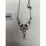 A silver Belle Epoque style openwork pendant set with paste stones