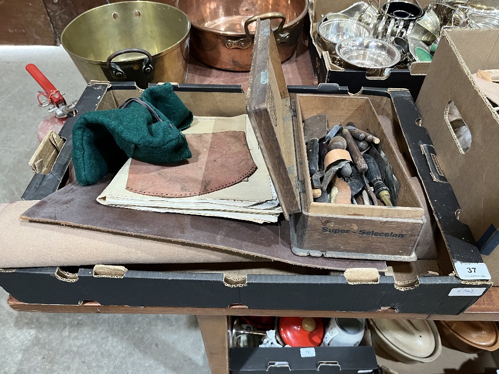 A collection of bookbinder's tools and materials