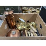 A box of copper and brassware with three vintage irons, butter mould etc.