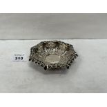 A Victorian silver repousse and pierced octagonal dish. Birmingham 1899. 4½' diam. 1oz 8dwts