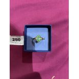 A green and white stone ring. In gold marked 375. 3g gross. Size P½