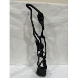 An African carved ebony openwork figural sculpture. 31' high. Losses