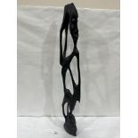An African carved ebony figural sculpture. 31½' high. Damaged