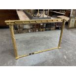 A Regency style gilt framed overmantle mirror of recent manufacture. 53'w x 33½'h. Burn mark to