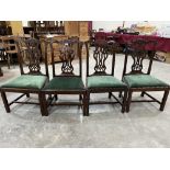 A set of four mahogany Chippendale style dining chairs with interlaced tracery splats. Backs weak,