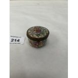 A continental pill box gilded and painted with summer flowers in coloured enamels
