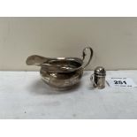 An Edward VII silver cream jug by Asprey and Co. Birmingham 1904; 4' long over handle. 1oz 7dwts;