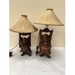 Two Japanese carved hardwood figural table lamps. The figures 12½' and 14' high. One shade A.F.