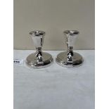 A pair of Elizabeth II silver squat candlesticks. Birmingham 1956. 3½' high. Loaded