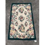 A kashmiri stitched wool chain rug. 1.14m x 0.8m