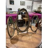 A gilt framed triptych dressing table mirror