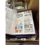 A box of stamps, albums and loose