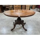 A Victorian walnut loo table, the marquetry and line inlaid oval snap-top on quadripartite carved