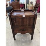 A George III mahogany tray-top night table, enclosed by a tambour shutter over drawers, on moulded